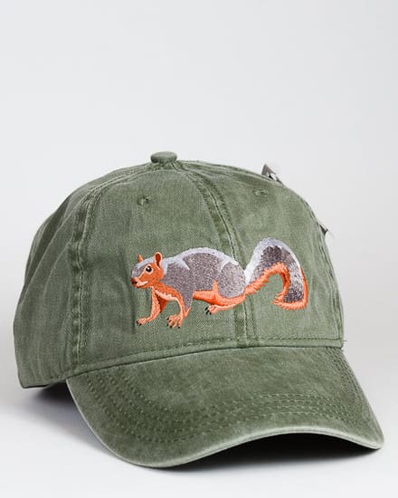 A green hat with an orange tail and a gray squirrel on it.