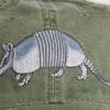 A close up of an animal on the side of a hat