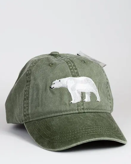 A green hat with a polar bear on it.