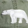 A close up of the polar bear on a hat