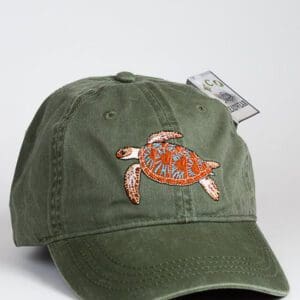 A Green Sea Turtle Cap with a turtle embroidered on it.