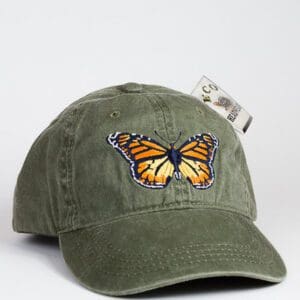 A green hat with an orange butterfly on it.