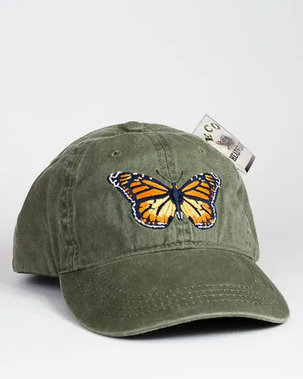 A green hat with an orange butterfly on it.