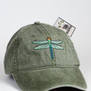 A green hat with a blue and yellow dragonfly on it.