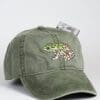 A green hat with a frog on it