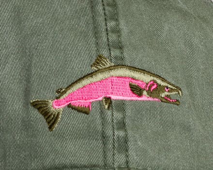 A fish patch is shown on the back of a jacket.