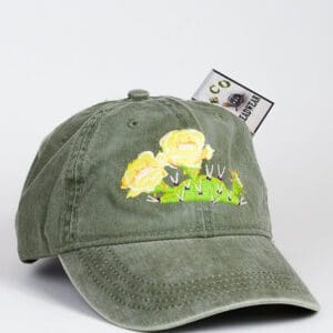 A Prickly Pear Cactus Bloom Cap with a yellow rose embroidered on it.