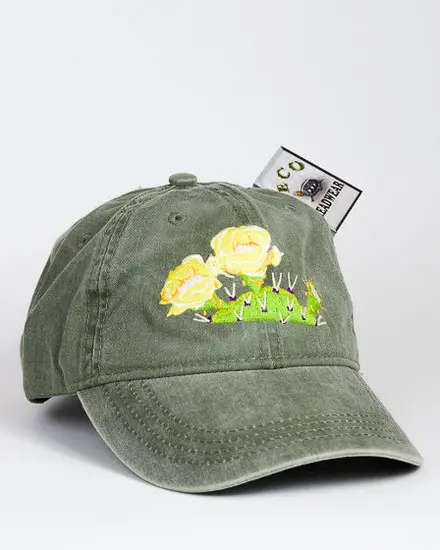 A Prickly Pear Cactus Bloom Cap with a yellow rose embroidered on it.
