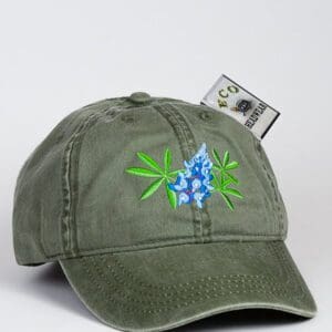 A green Blue Bonnet Cap with a blue flower embroidered on it.