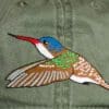 A close up of the bird on the hat