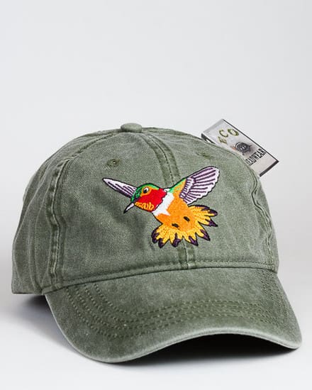 A green hat with an embroidered bird on it.