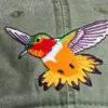 A close up of the bird on the hat