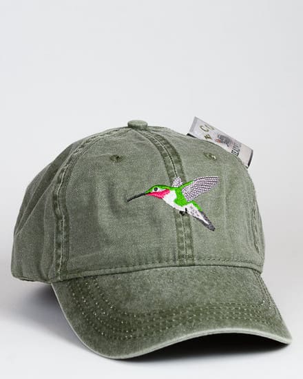 A green hat with a hummingbird on it.