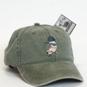 A hat that is sitting on top of a dollar bill.