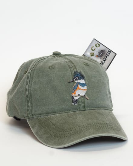 A hat that is sitting on top of a dollar bill.