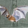 A close up of an embroidered bat on the back of a hat