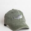 A green hat with a fish on it