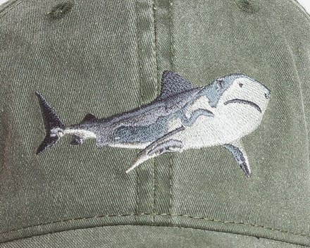 A close up of the shark on a hat