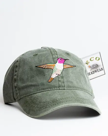 A green hat with a hummingbird on it.