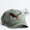 A hat with an eagle on it and a tag