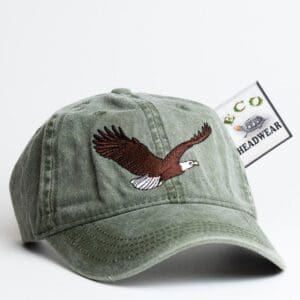 A hat with an eagle on it and a tag