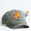 A green hat with an orange fish on it.