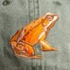 A close up of the frog on the back of a hat