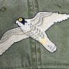 A close up of the bird on the hat