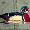 A close up of the duck on a hat
