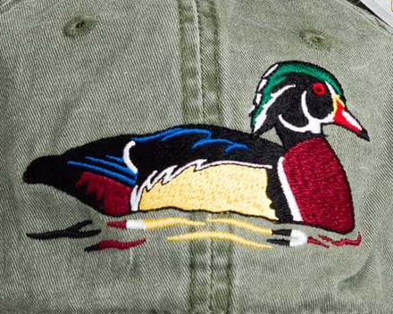 A close up of the duck on a hat