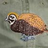 A close up of the bird on the hat