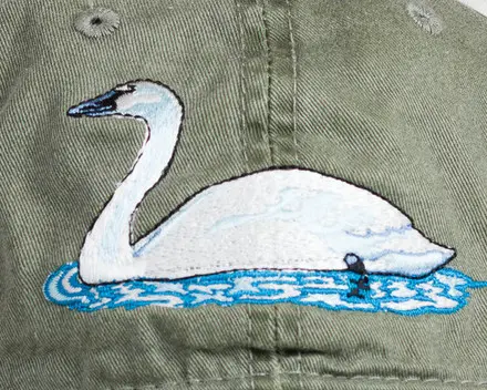 A close up of the swan on the back of a shirt