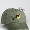 A hat with a bird on it and a dollar bill