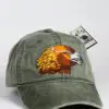 A green hat with an eagle on it