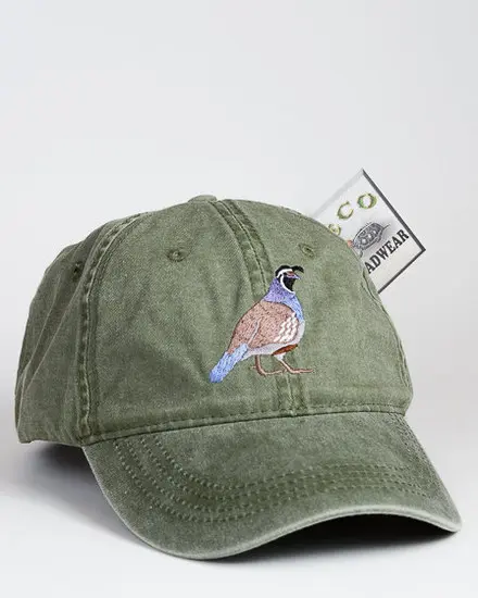 A green hat with a bird on it