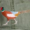 A close up of the bird on the hat