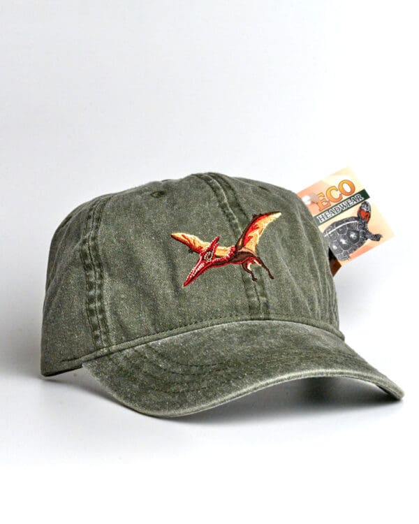 A Pileated Woodpecker Cap with a bird embroidered on it.