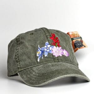 A Pileated Woodpecker Cap with a flower embroidered on it.