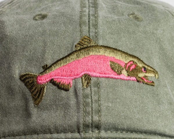 A fish is embroidered on the side of a hat.
