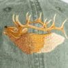 A close up of the deer 's head on a hat