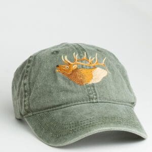 A green hat with an embroidered deer head on it.