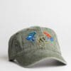 A green hat with some patches on it