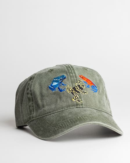 A green hat with some patches on it