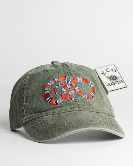 A green hat with an orange and red snake on it.