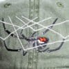 A close up of the spider on a hat
