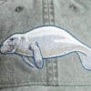 A close up of the back of a hat with an animal on it