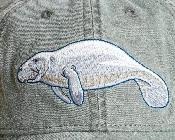 A close up of the back of a hat with an animal on it