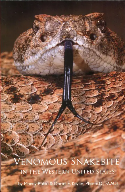 A snake with its tongue hanging out of it's mouth.
