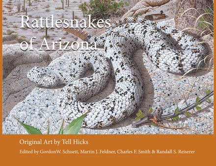 A book cover with two snakes laying on top of each other.