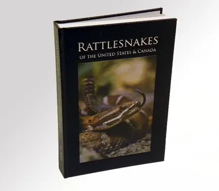 A book with an image of a snake on the cover.